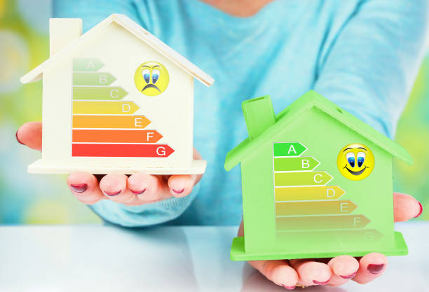 istock concept comparison between normal house and low consumption house with energy efficiency rating 1184848299