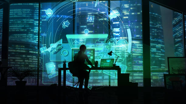 istock Silhouette of a woman in an office working with a virtual interface. 1184848679