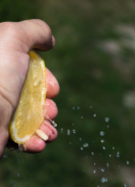 istock A lemon in the hand of a man. 1184850031