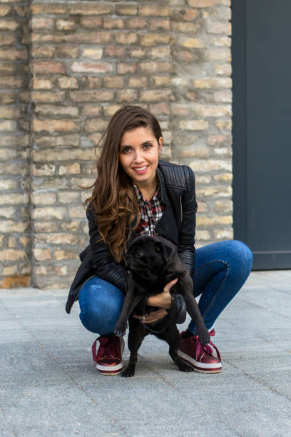 istock Woman and her dog 1184850407