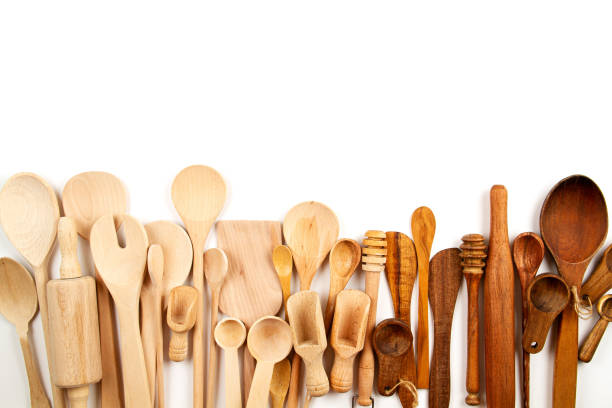 istock Collection of wooden kitchen utensils over white background 1184850437