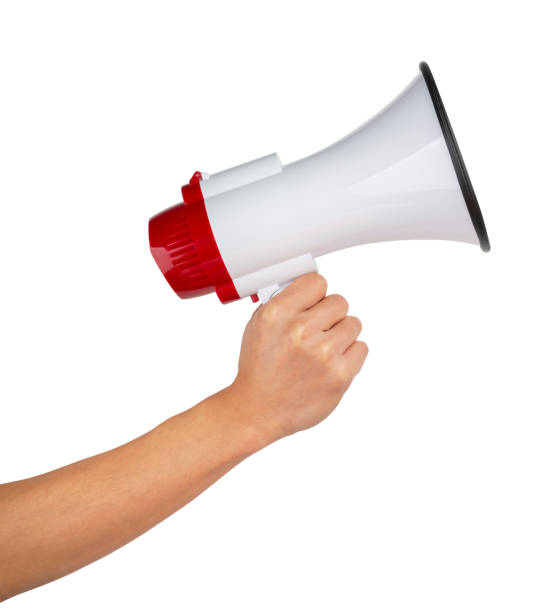 istock Announcement concept. Shout It Out. Hand holds megaphone on white background. 1184851496