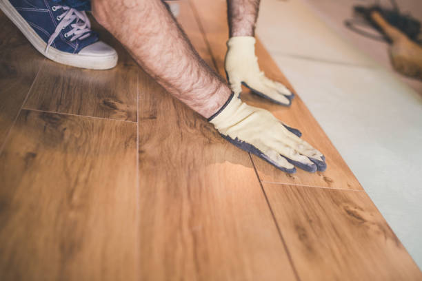 istock Flooring technology - laying of a floating laminate floor 1184851856