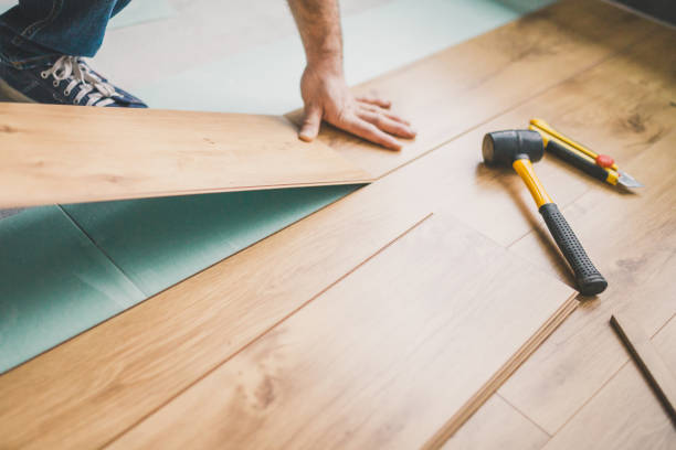 istock Laying a new laminate with a wooden pattern 1184852621