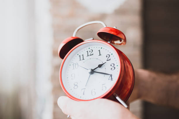 istock Early rise to work - a red alarm clock 1184852892