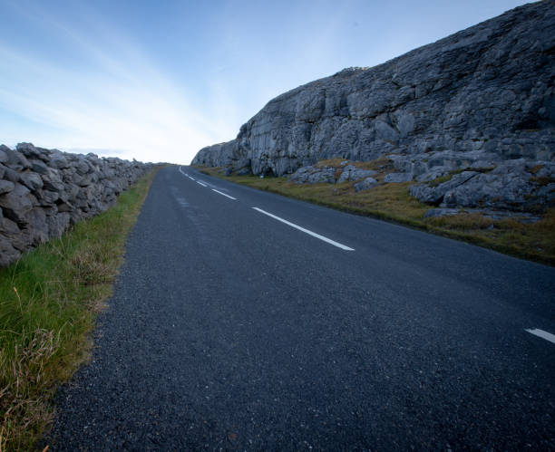 istock Lonely stretch highway in Ireland 1184854696