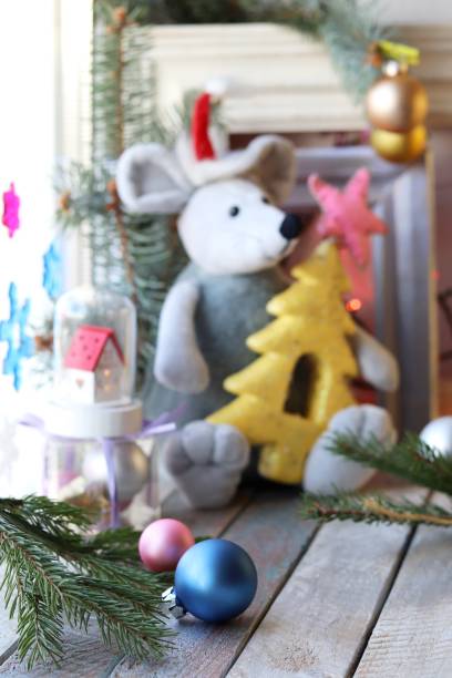 istock Toy rat in a Santa hat, Christmas decor, spruce branches, frames, illumination 1184855850