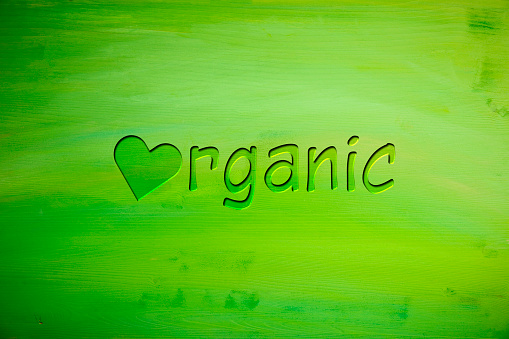 Written word Organic on green babkground