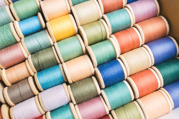 istock rolls of colorful threads, close-up and top view. 1184863899
