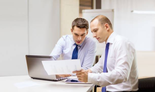 istock two businessmen having discussion in office 1184864439