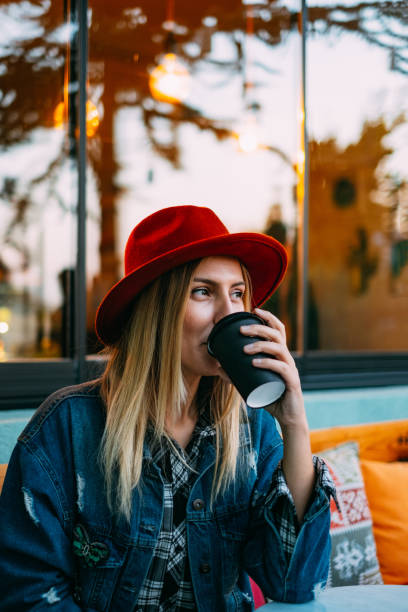 istock Woman Drinking Coffee in Reusable Cup 1184864490