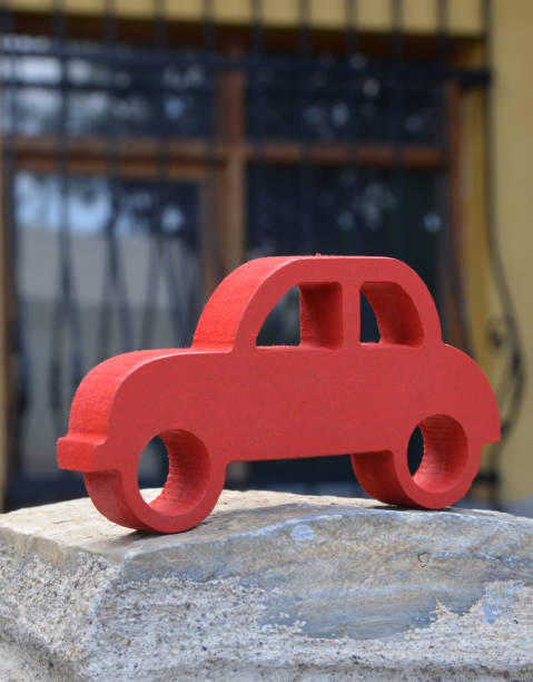 istock handmade miniature red toy car 1184864596