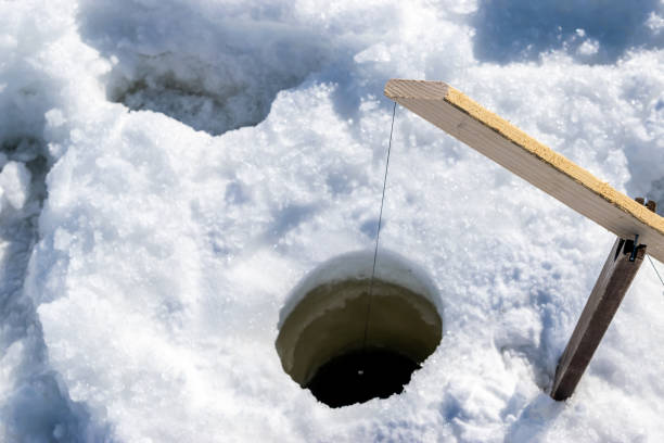 istock Ice fishing in Canada. 1184865144