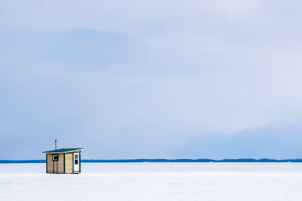 lakeside cottages in snowy winter landscape