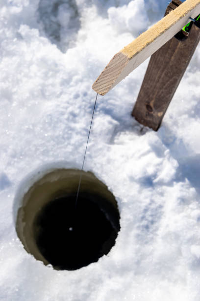 istock Ice fishing in Canada. 1184865233