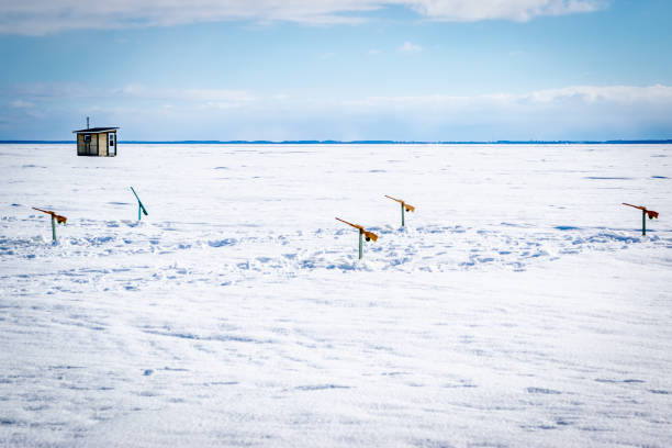 istock Ice fishing in Canada. 1184865255