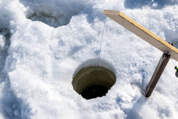 istock Ice fishing in Canada. 1184865381