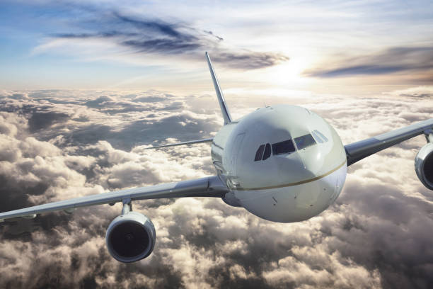 istock Passenger airplane flying over the clouds 1184865407