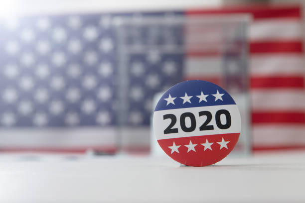 istock Ballot box and election vote buttons on table 1184868547