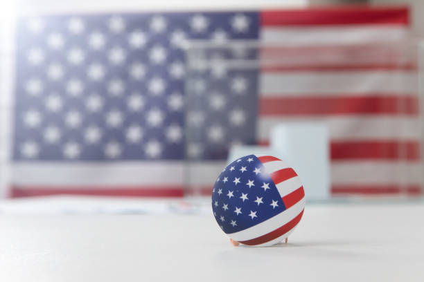 istock Ballot box and election vote buttons on table 1184868668