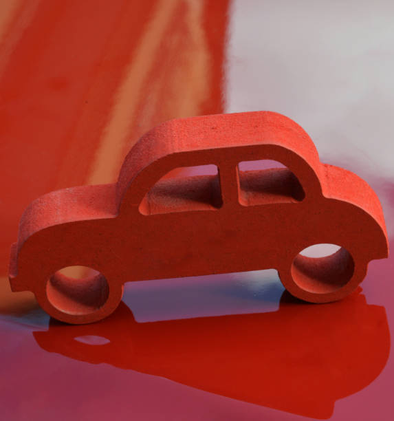 istock handmade miniature red toy car 1184871448