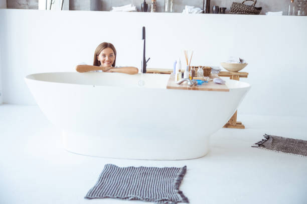 istock Cute female is looking straight at camera 1184874756