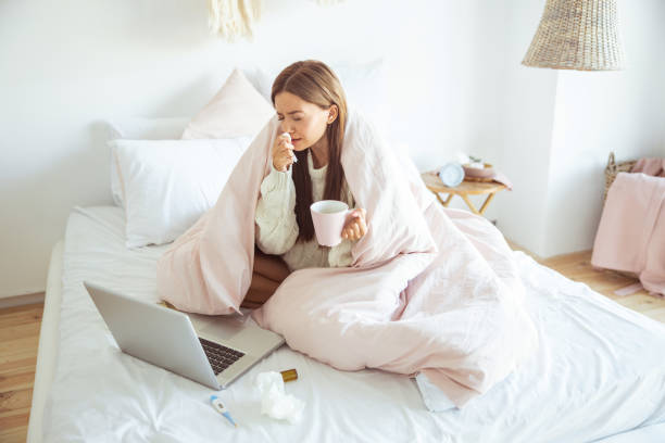 istock Negative long haired brunette wiping her nose 1184874965