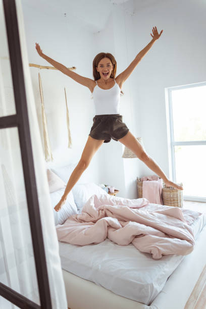 istock Positive delighted young brunette posing on camera 1184875063