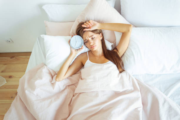 istock Bored young female being deep in thoughts 1184875934