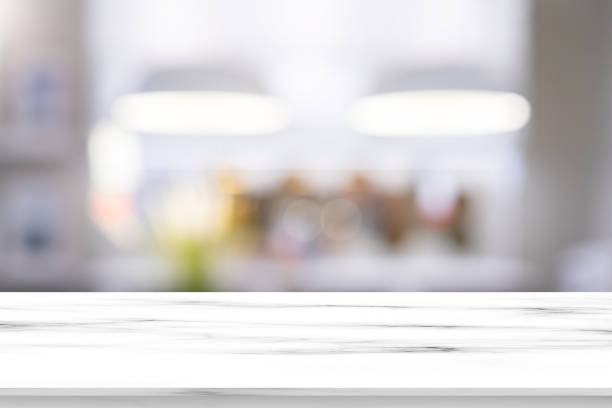 istock abstract blur inside interior luxury and modern kitchen room with white marble quartz texture perspective counter for show, promote content and ads banner on display concept 1184876418