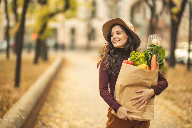 istock Woman after grocery shopping 1184877351