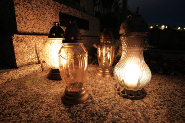 istock Graveyard lamps on cemetery in night 1184877491