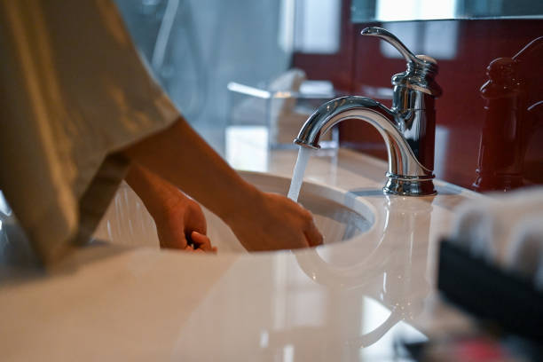 Unrecognizable woman washing her hands, midsection, Nikon Z7