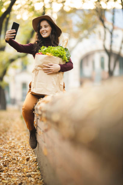 istock Taking a selfie and taking a break after grocery shopping 1184880999