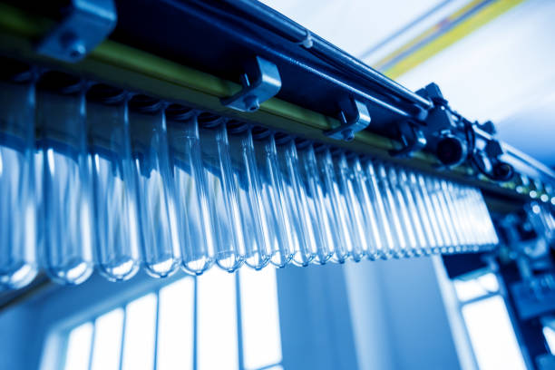 istock The plastic bottle blowing machine. PET preforms for blowing of plastic bottles. Heating process. 1184884215