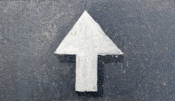 istock traffic direction sign arrow on the road 1184885231