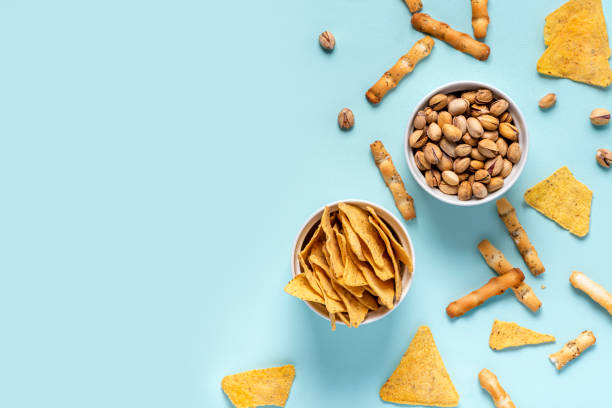 nachos, pistachios and cheese sticks - beer nuts imagens e fotografias de stock