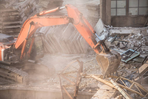 istock excavator bucket destroys an old building on site 1184886080