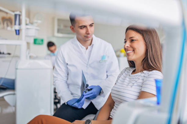 istock Dentist showing a patient her x-ray 1184886167