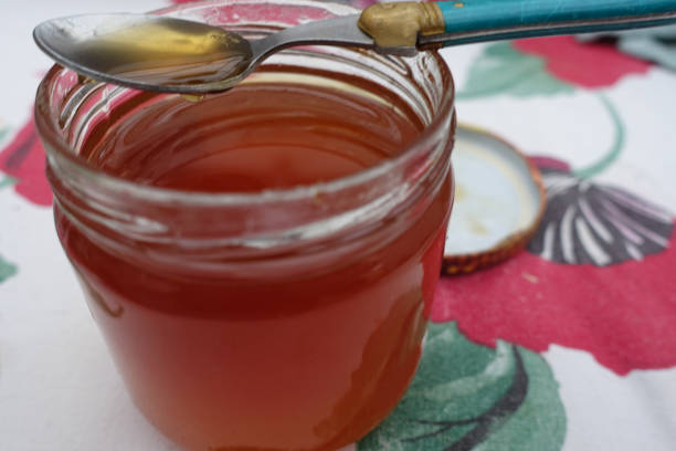 istock Honey all flowers in jar  Liquid honey 1184887123