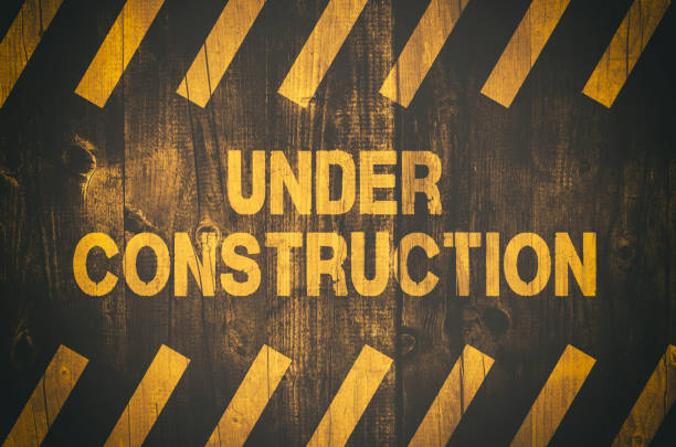 Under construction warning sign stock photo