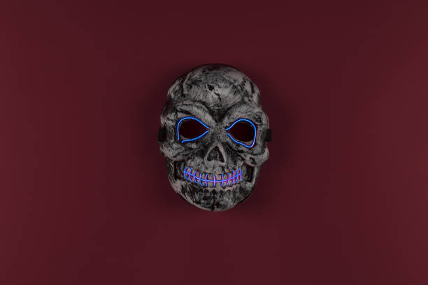 istock scary skull mask on a red background 1184889786