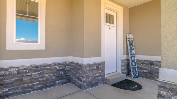 istock Panorama frame Front veranda of modern home with welcome sign 1184890546