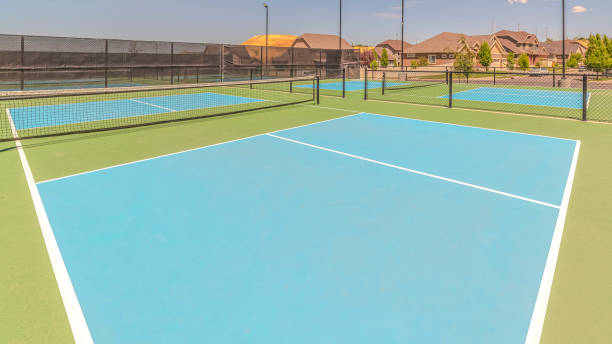 istock Panorama frame Turf tennis courts with no people on sunny day 1184890701