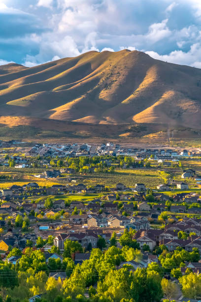 istock Town nestling in a valley with green trees 1184890782
