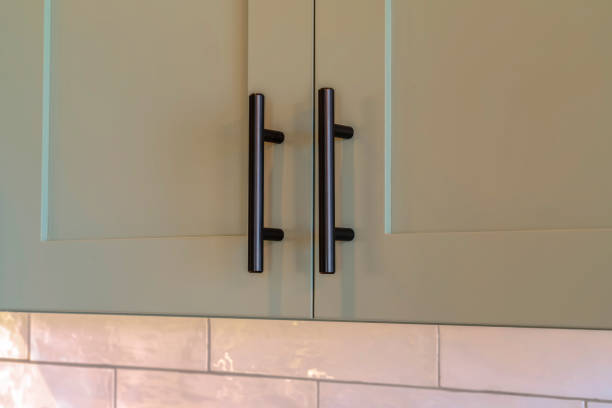 istock Close up of overhead kitchen cupboard handles 1184891785