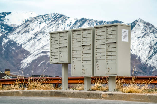istock Mailboxes with compartments and numbers against snowy mountain and cloudy sky 1184891858