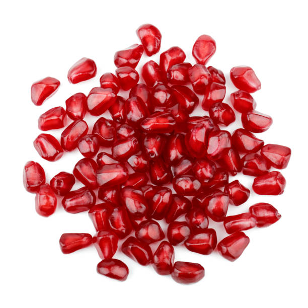 istock Seeds of pomegranate isolated on white background 1184892075