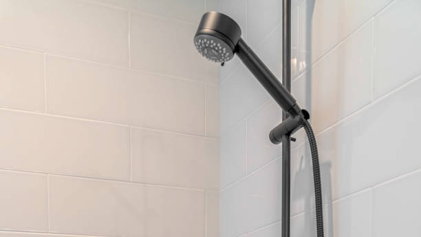 istock Panorama frame Contemporary white shower with black fittings white tile 1184892261