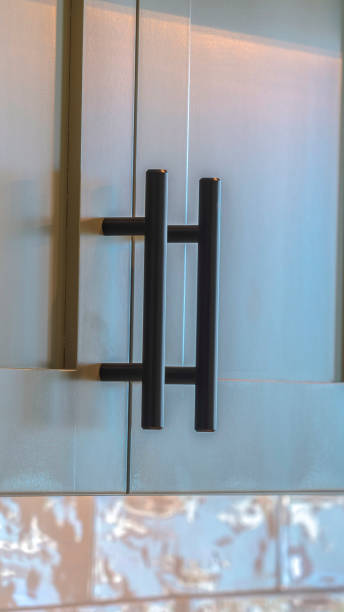 istock Vertical frame Close up of modern kitchen cupboards and handles 1184893596